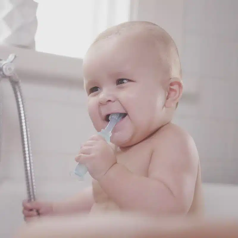Baby using Haakaa ° Baby Toothbrush with Suction Base