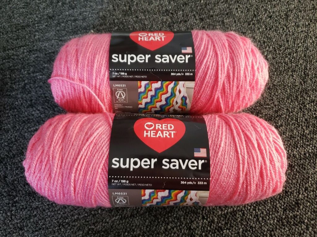 Red Heart Super Saver Perfect Pink Yarn on a surface