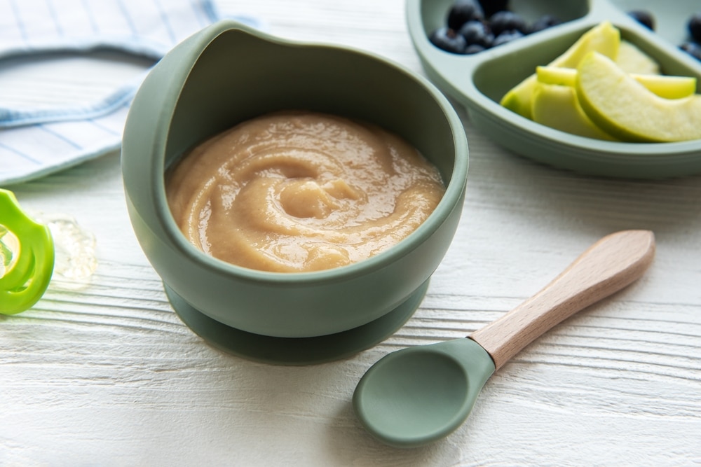 organic baby cereal in a bowl with a spoon