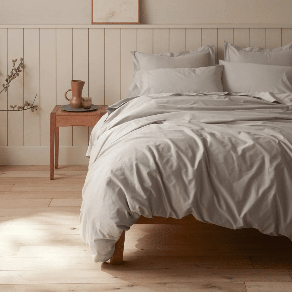 A view of a sateen sheet on a bed