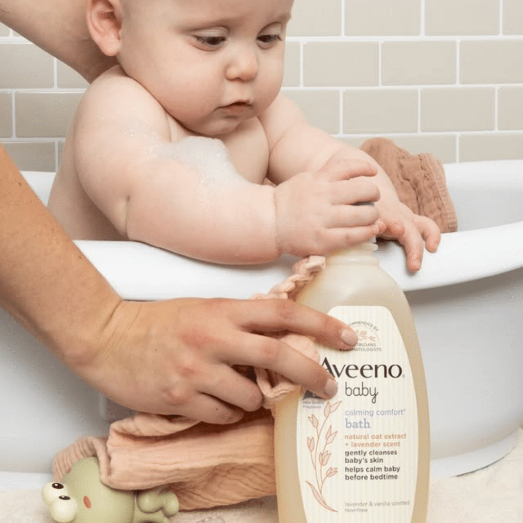 Baby taking shower with Aveeno baby shampoo