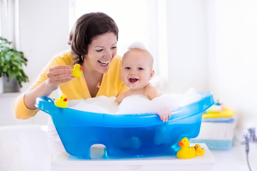 Happy Baby Taking A Bath Playing With Foam Bubbles Mother