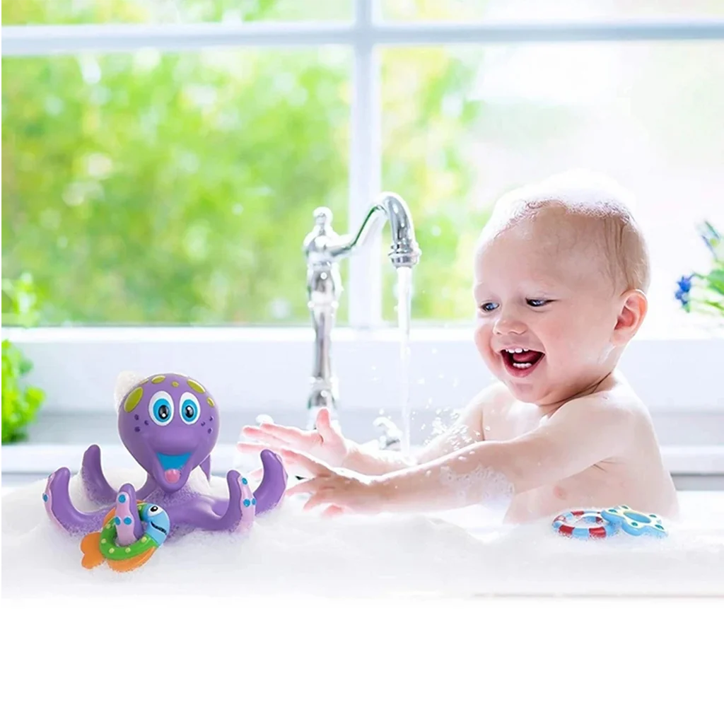 a kid playing with Nuby Floating Octopus Bath Toy​