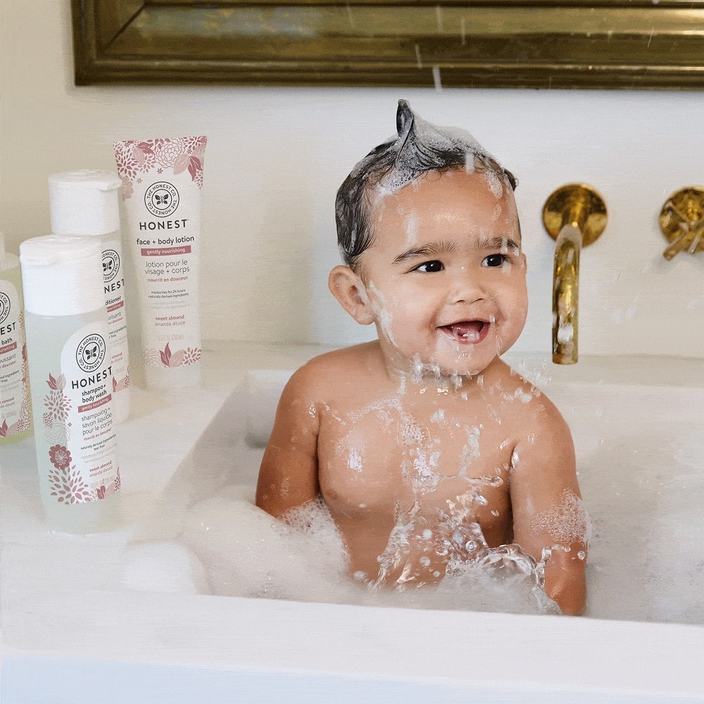 baby taking shower with Honest Company in Shampoo Body Wash placed