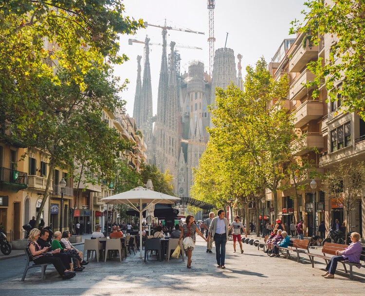 people are walking in the streets of barcelona