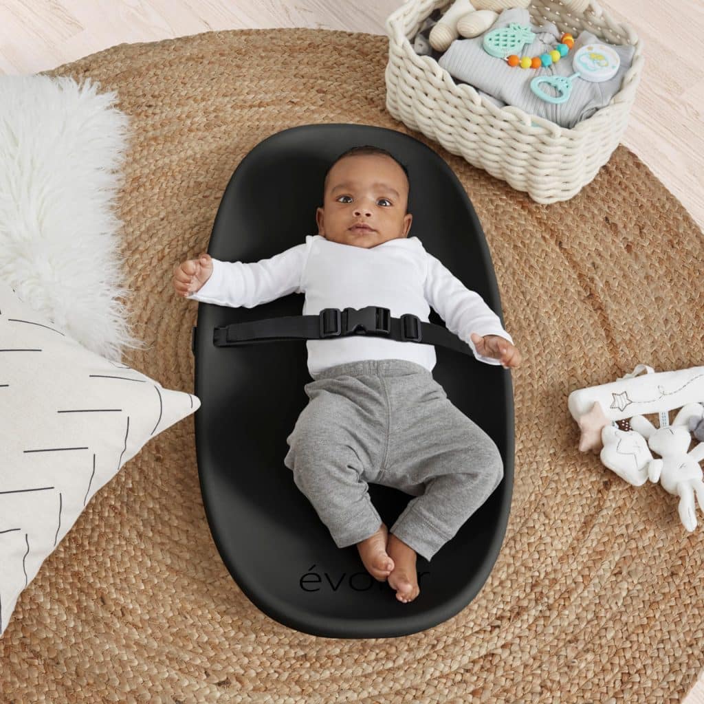 A baby in Evolur Eva Baby Changing Pad