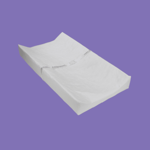 Delta Children Foam Contoured Changing Pad isolated on a purple background