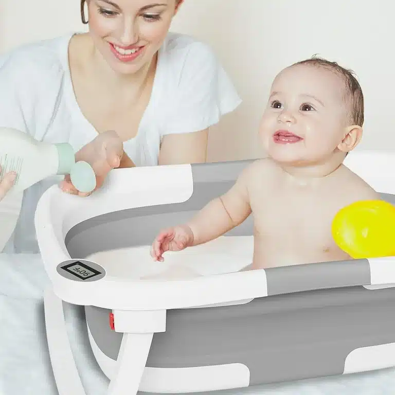 a baby showering in Collapsible Baby Bathtub