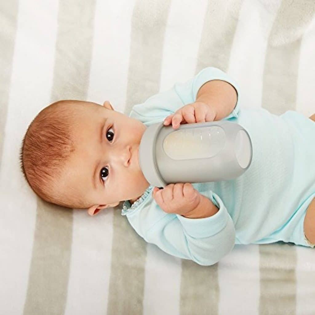 baby drinking from Boon Nursh Reusable Silicone Pouch Bottles