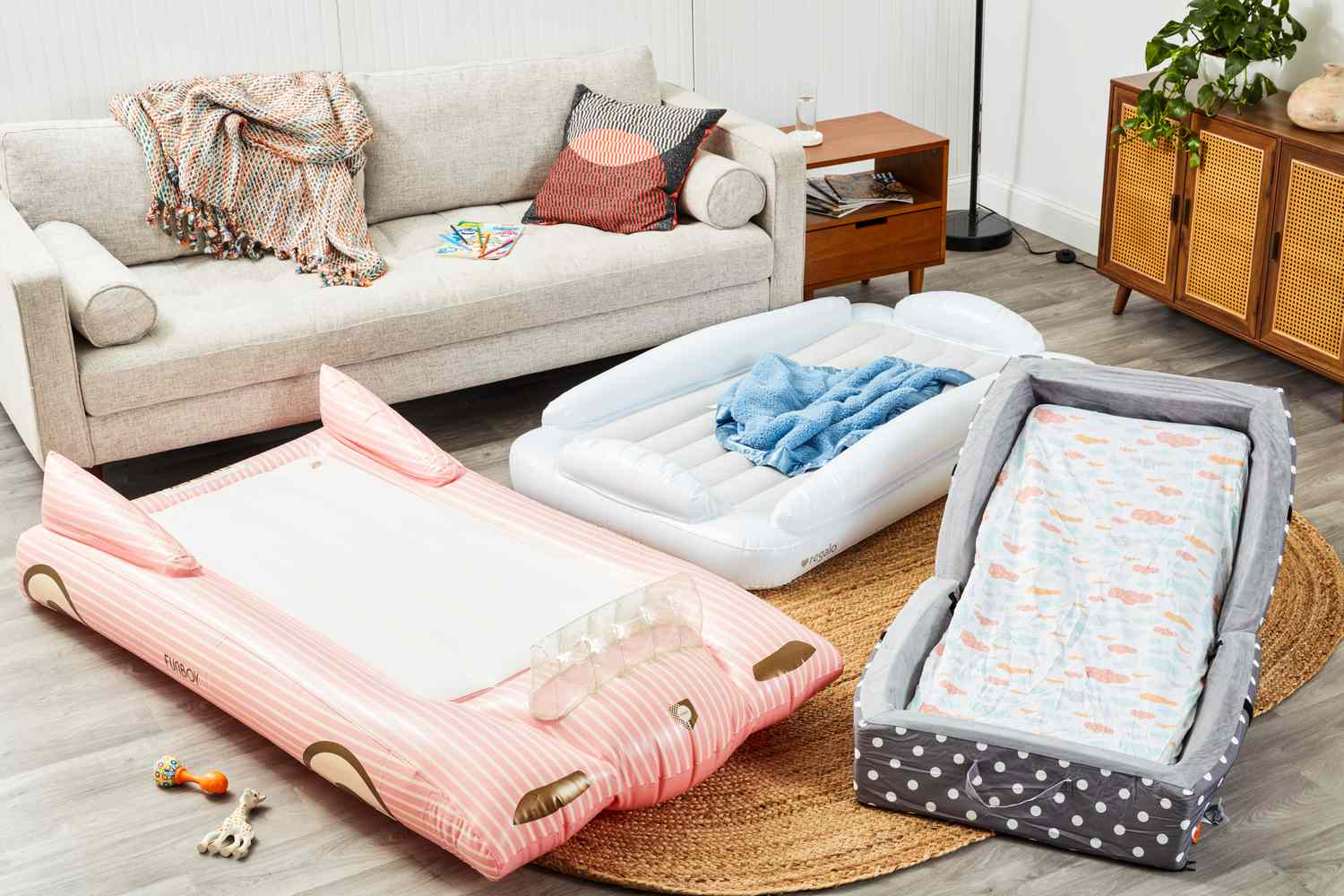 inflatable toddler travel beds in a living room