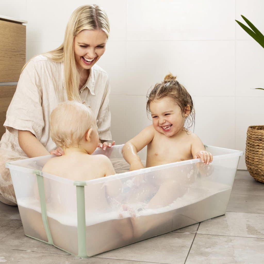 toddlers sitting in Stokke Flexi Bath X Large tub