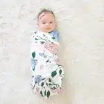 baby girl wrapped up in a swaddle
