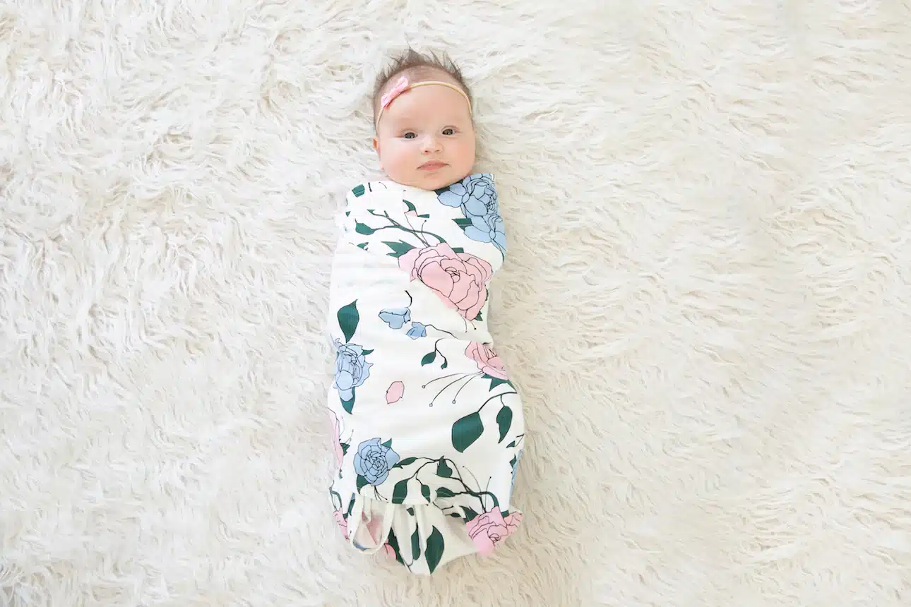 baby girl wrapped up in a swaddle