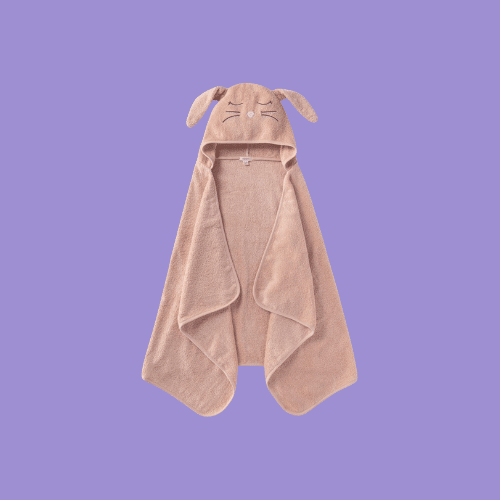 Burt’s Bees Baby Infant Hooded Towel in brown color isolated on a purple background