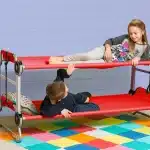 kids playing in a double toddler cot