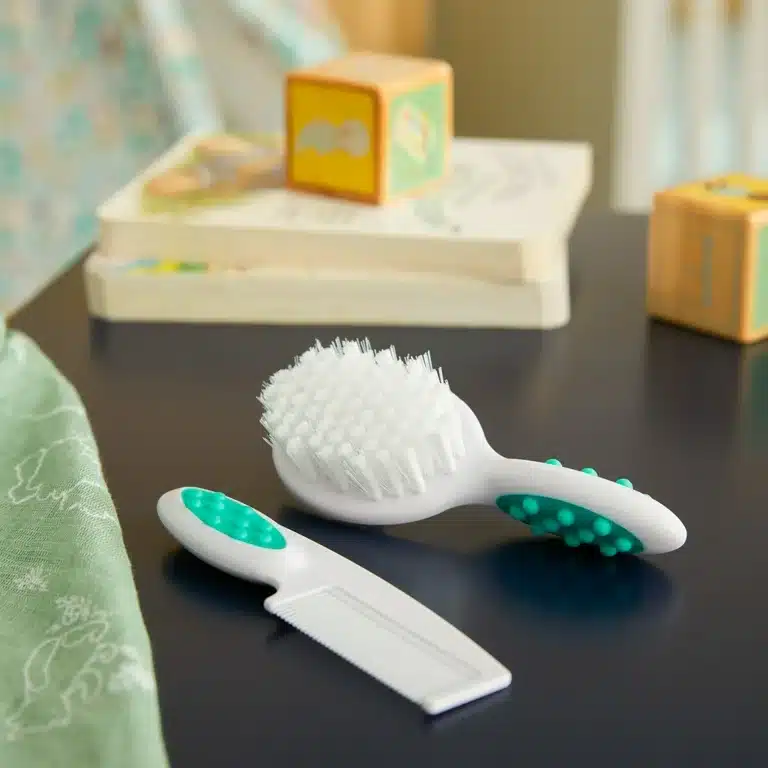 Safety st Easy Grip Brush and Comb placed on a surface