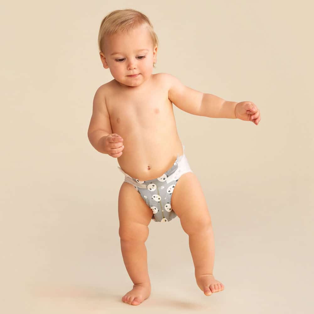 a baby wearing honest company diaper