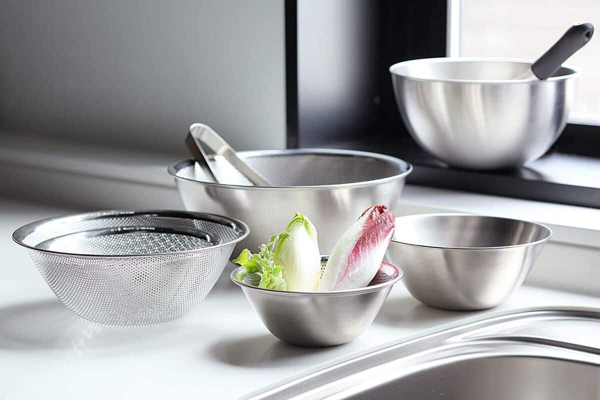 colander and bowls placed on a counter