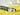A view of a can opener on a yellow cloth
