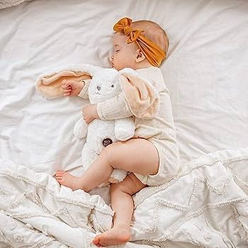 a baby girl sleeping wearing Jesries Soft Nylon Hairband