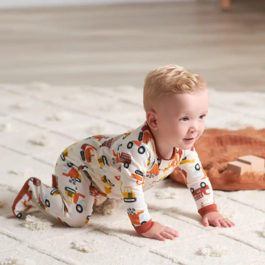 a baby wearing Gerber Baby Boys Pack Sleep ’N Play Footie