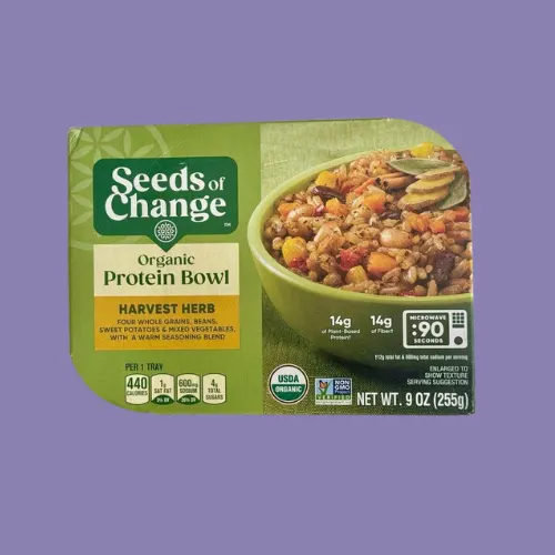 SEEDS OF CHANGE Organic Microwaveable Brown Rice isolated on a purple background