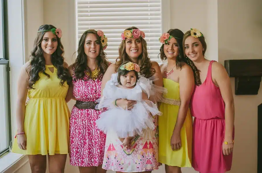 ladies ready for a sip and see party holding a baby girl